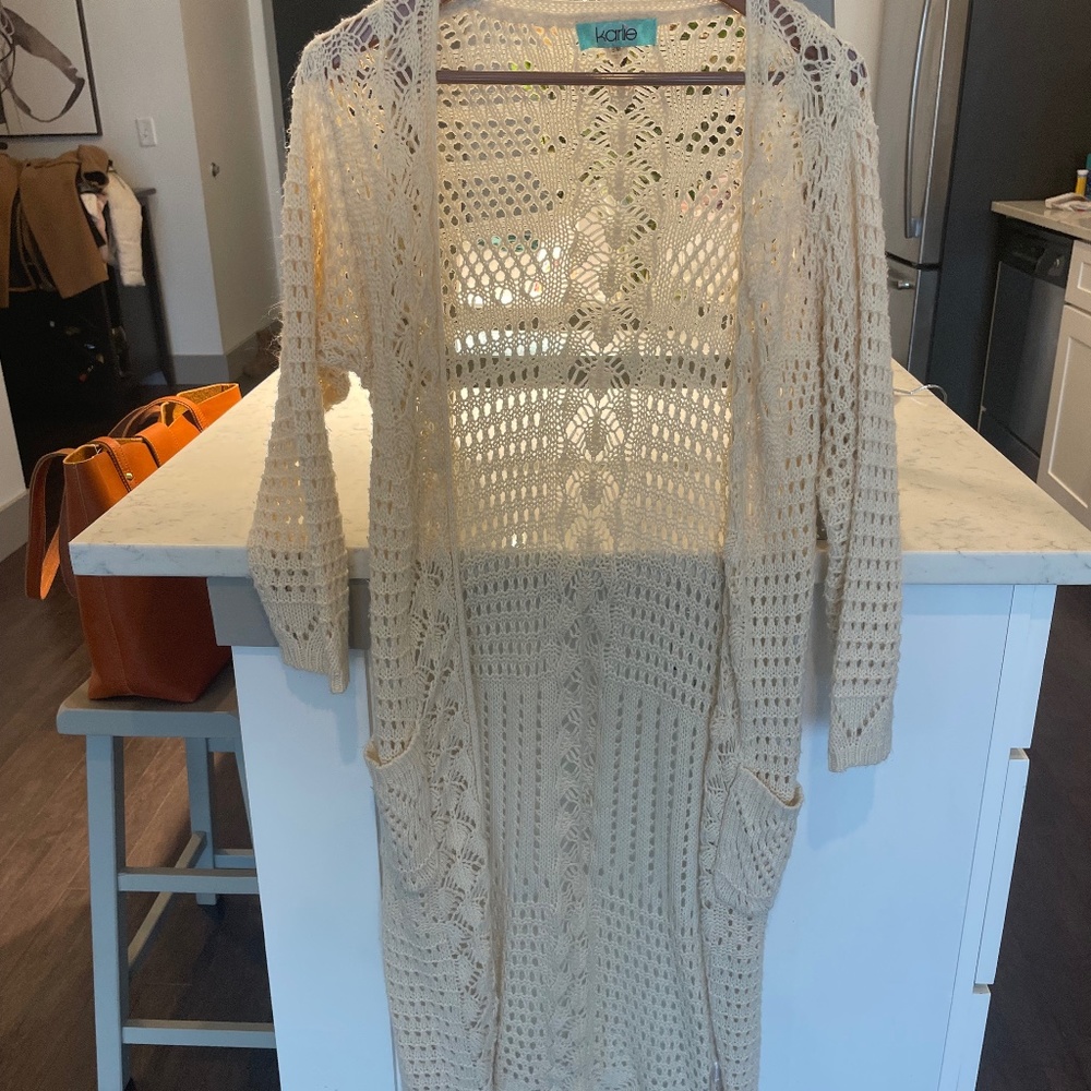 Cream colored knit duster with pockets